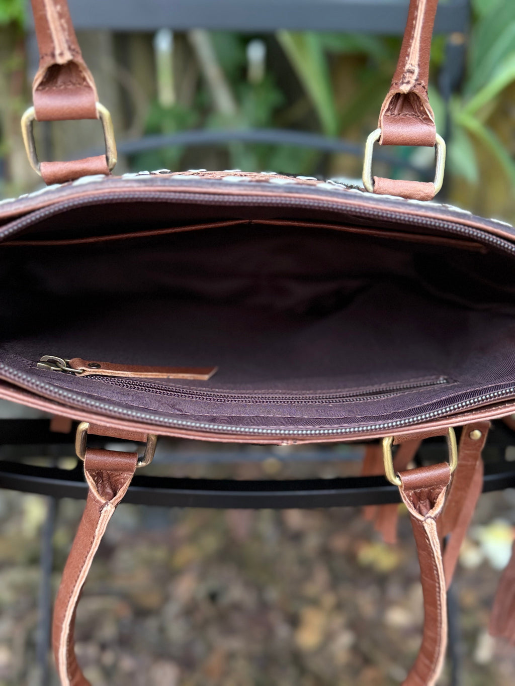 The Frontier Fringe Carryall | Cowhide, tooling, fringe, and function. Includes concealed carry pocket and two ways to wear