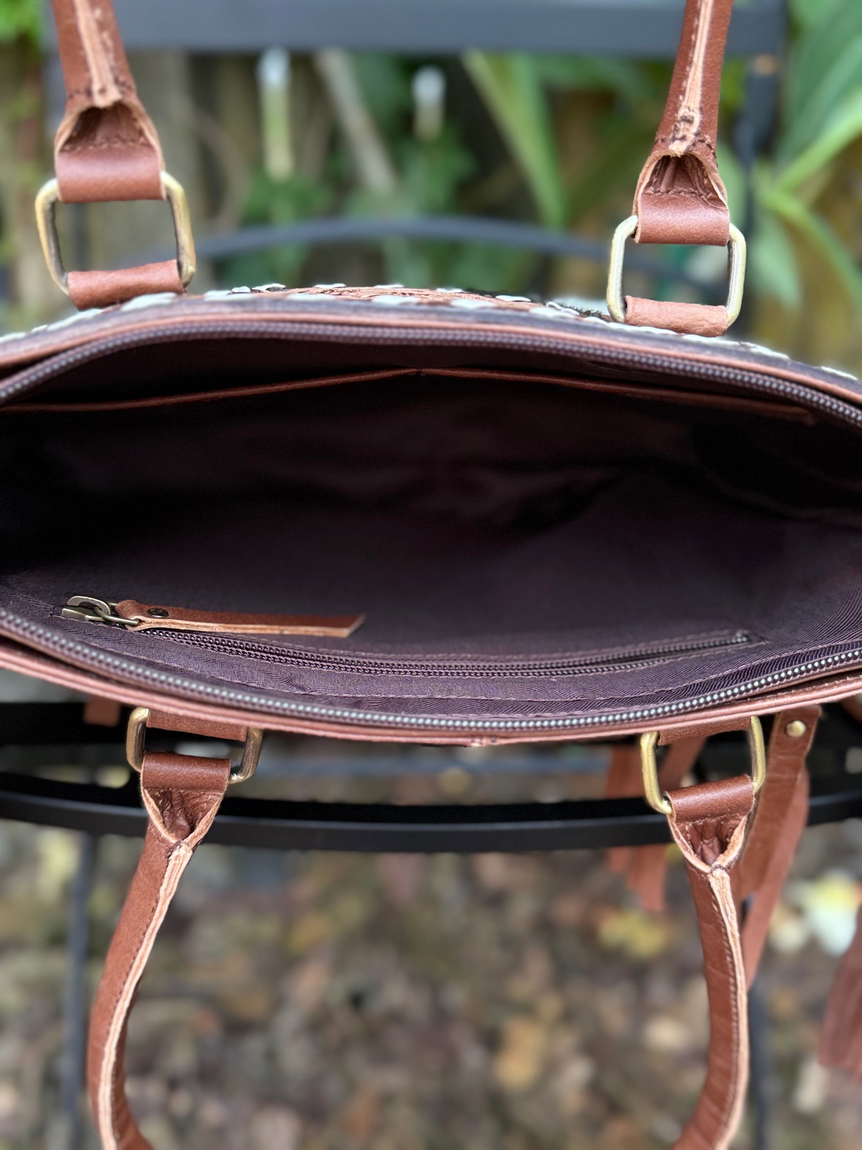 The Frontier Fringe Carryall | Cowhide, tooling, fringe, and function. Includes concealed carry pocket and two ways to wear